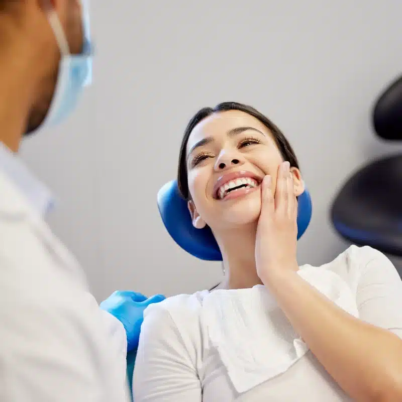 Patient smiling at dentist during checkup